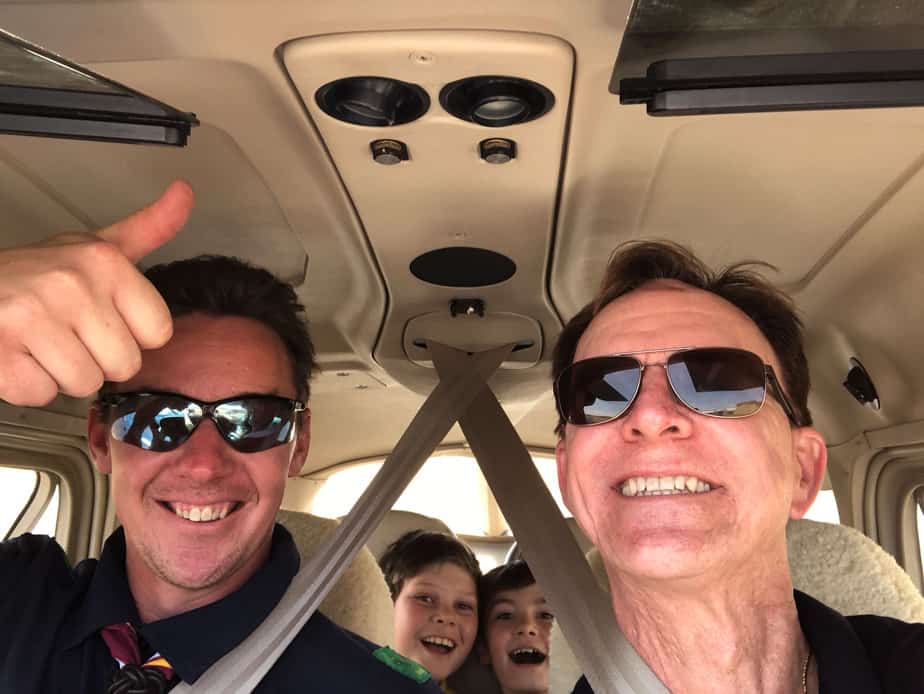 Two pilots with Scouts in the backseat